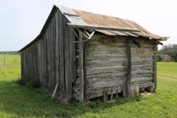 The log cabin before restoration